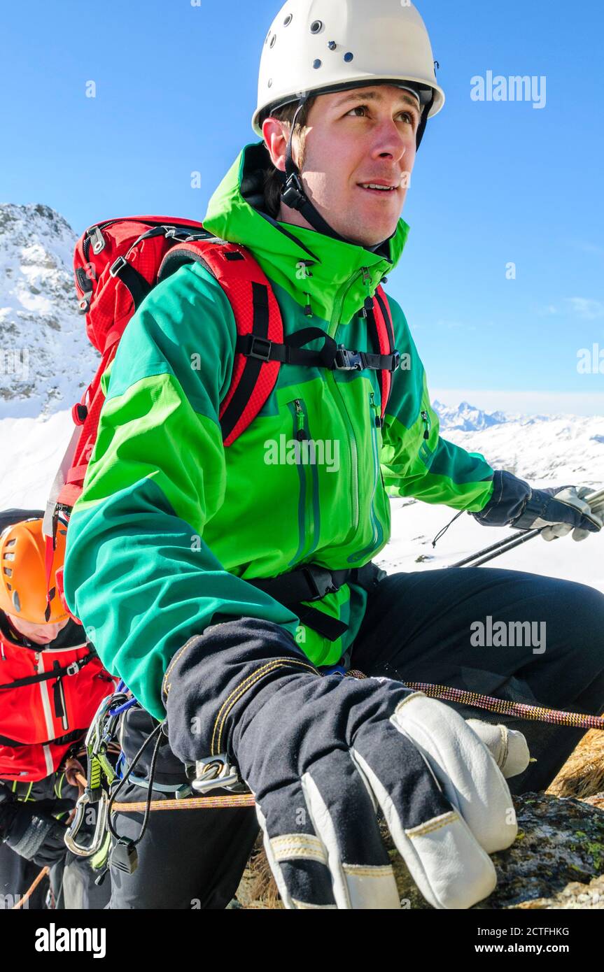 Alpinists climbing in high alpine region near Gressoney in Italy Stock Photo