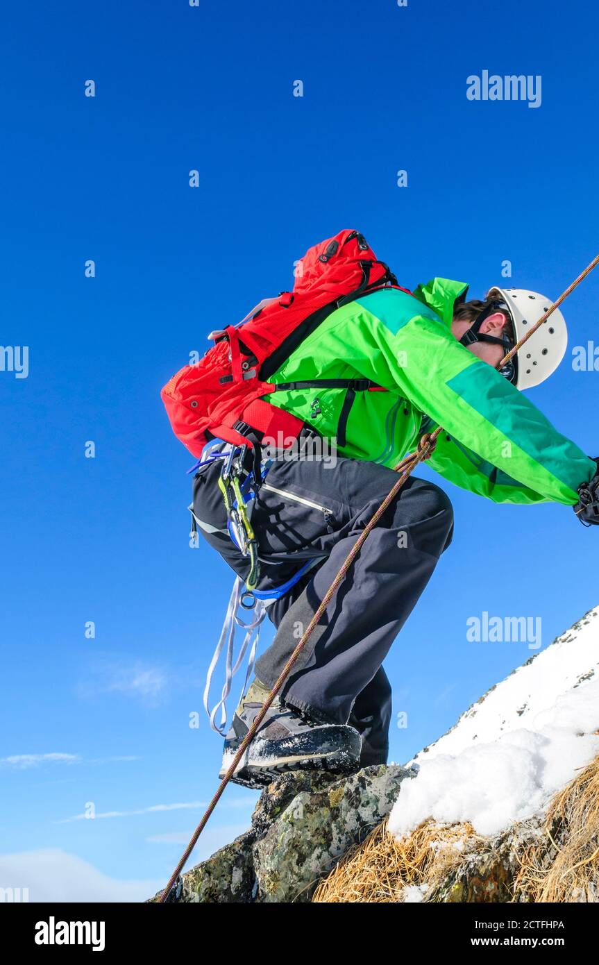 Alpinists climbing in high alpine region near Gressoney in Italy Stock Photo