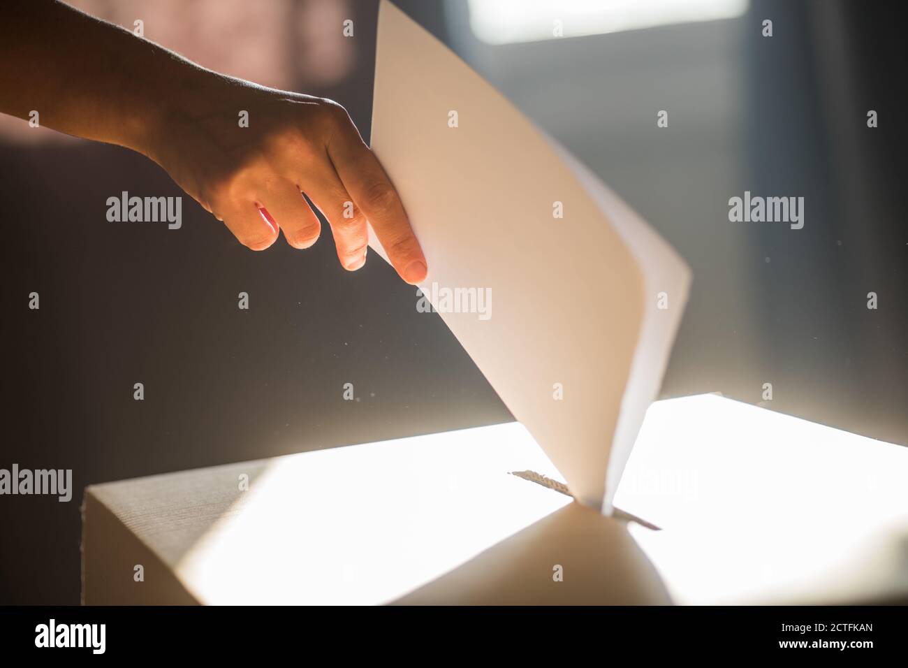 Polling Ballet Conceptual image of a person voting, casting a ballot at a polling ...