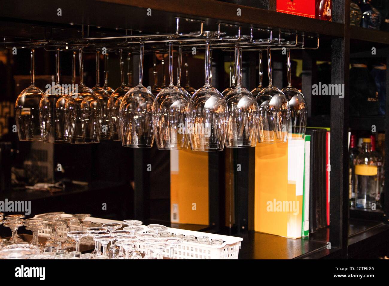Transparent glasses hanging upside down at the restaurant Stock Photo