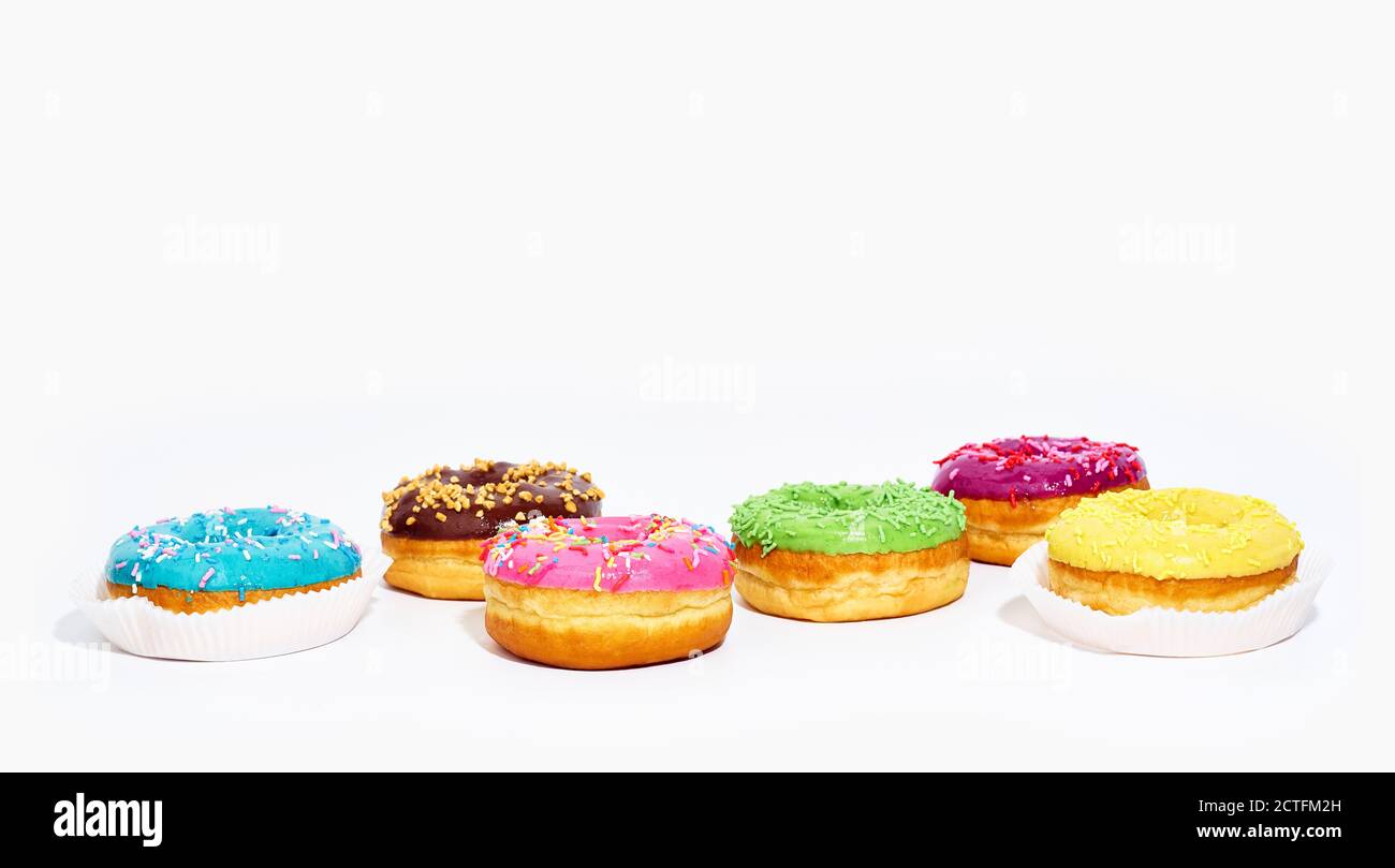 Sweet glazed donuts isolated on white background with copy space. Junk ...