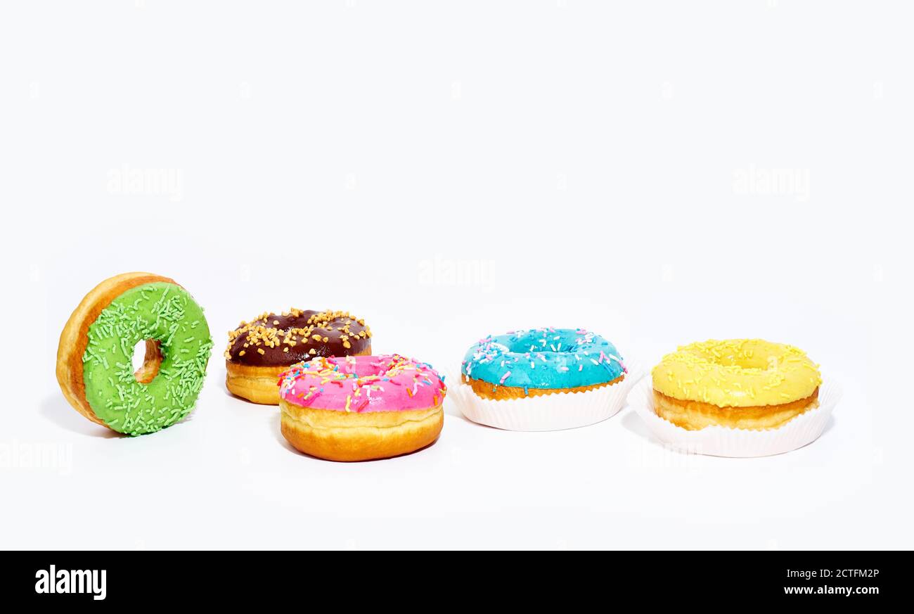 Sweet glazed donuts isolated on white background with copy space. Junk ...