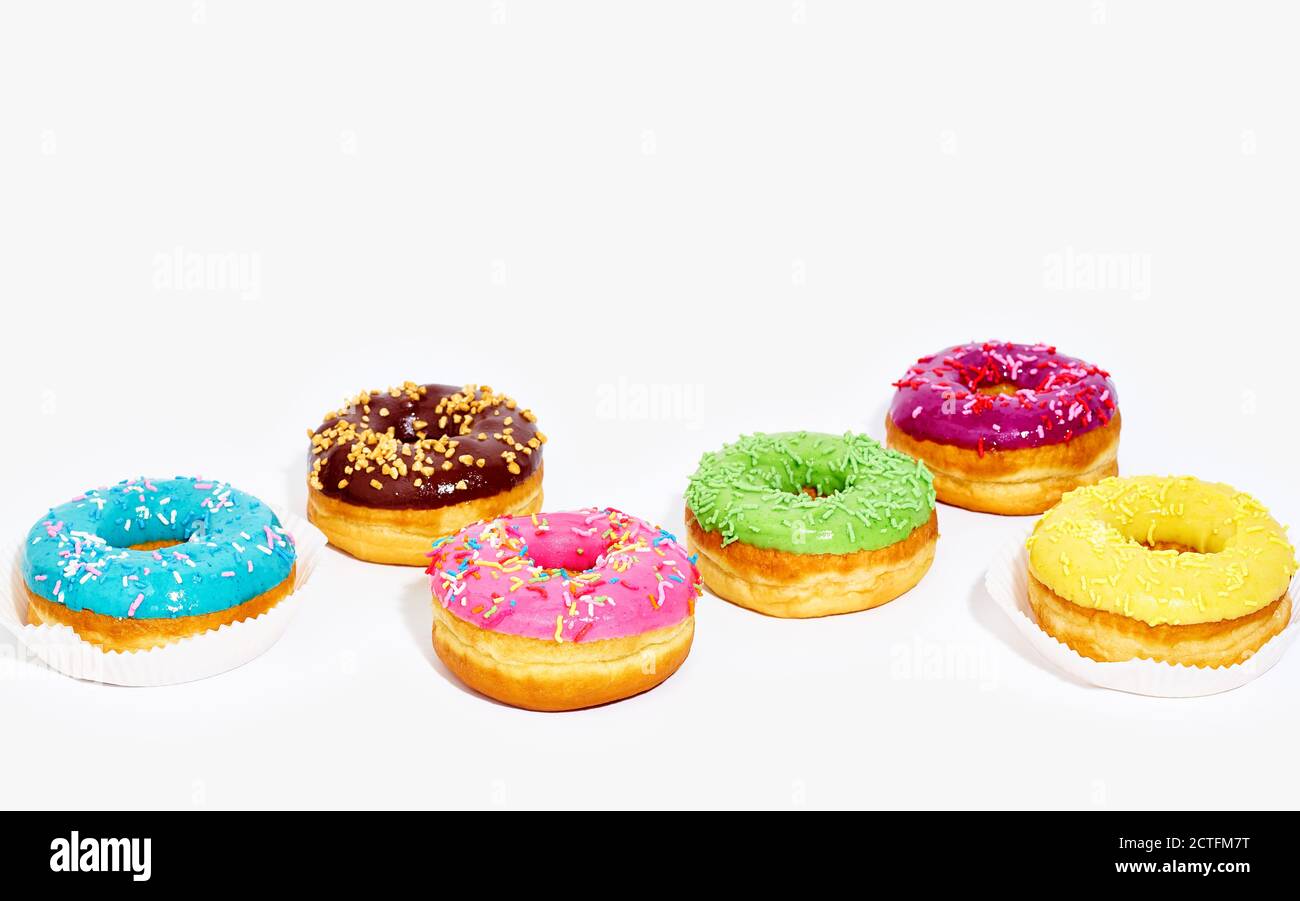 Sweet glazed donuts isolated on white background with copy space. Junk ...