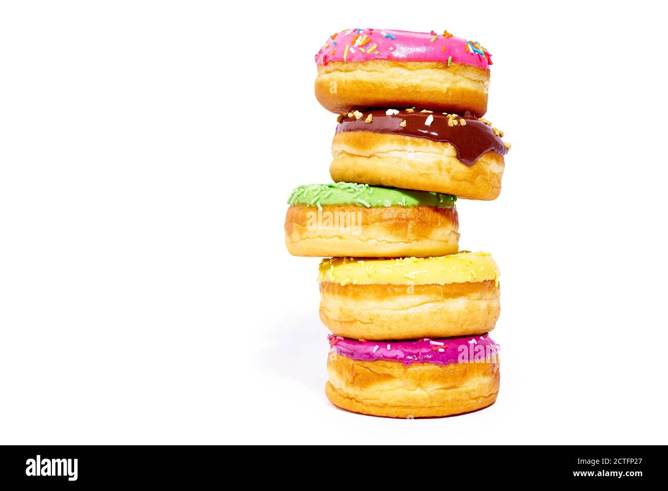 A pile of glazed donuts isolated on white background with copy space ...