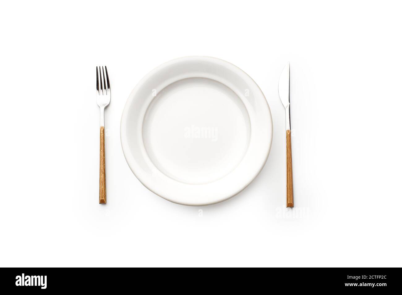 Flat lay white empty plate and cutlery isolated on white background ...