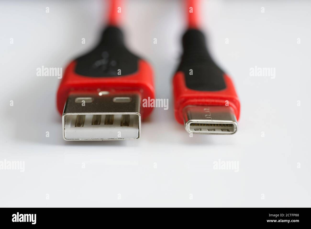 Detail of front entrance of USB versus USBC cable plugs Stock Photo