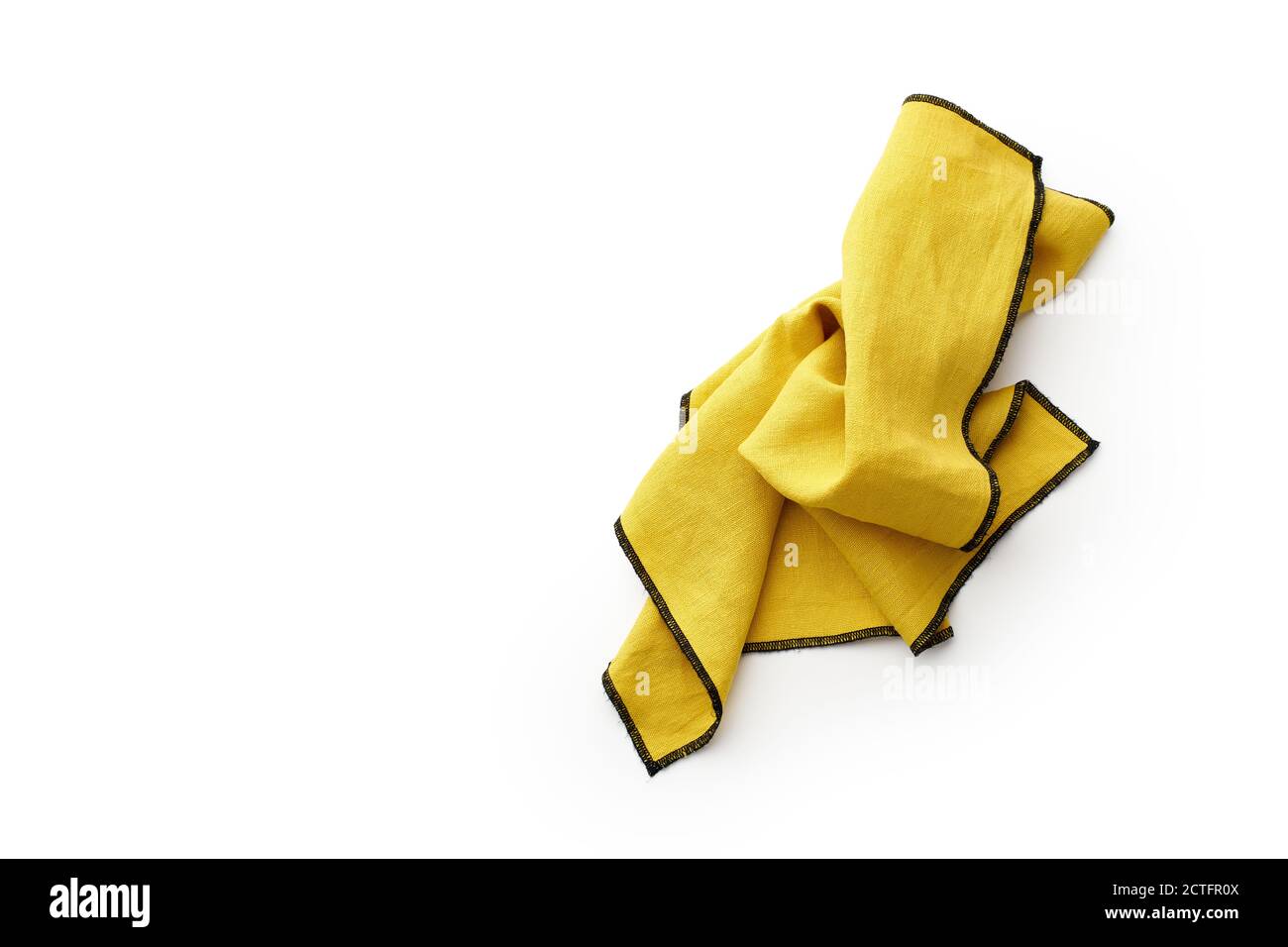 Flat lay with yellow linen kitchen napkin isolated on white background. Folded cloth for mockup with copy space Stock Photo