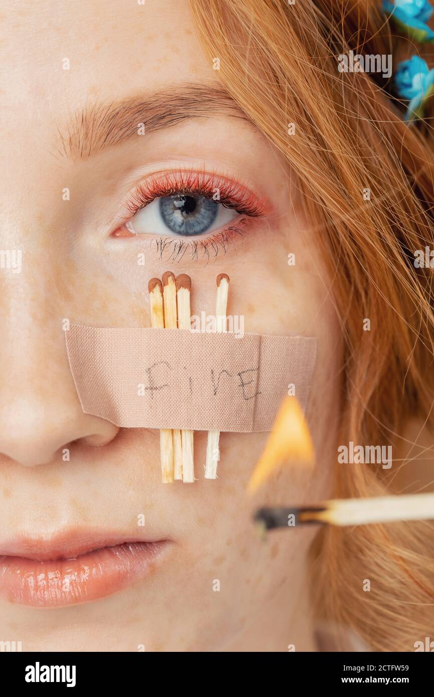 Beautiful macro female eye with long red color eyelashes and fashion