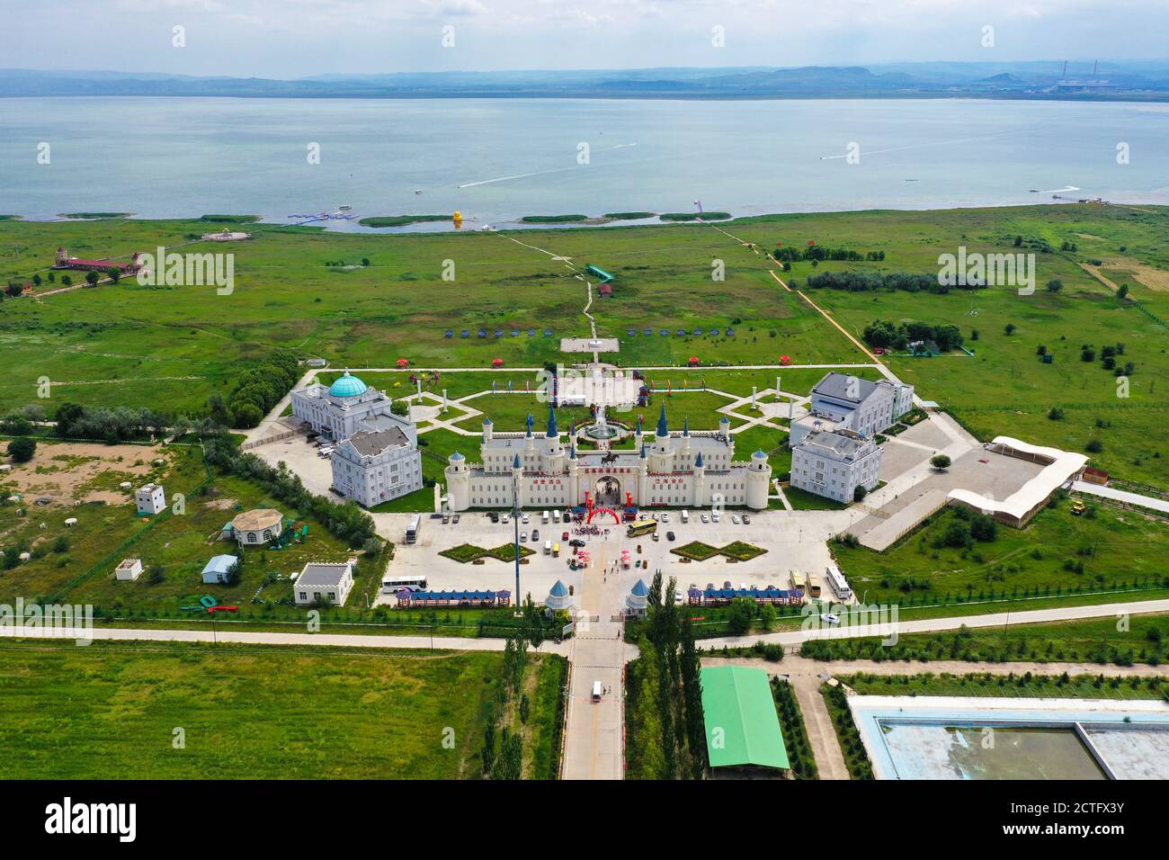 Aerial view of a European style castle by Lake Dai in Ulanqab city