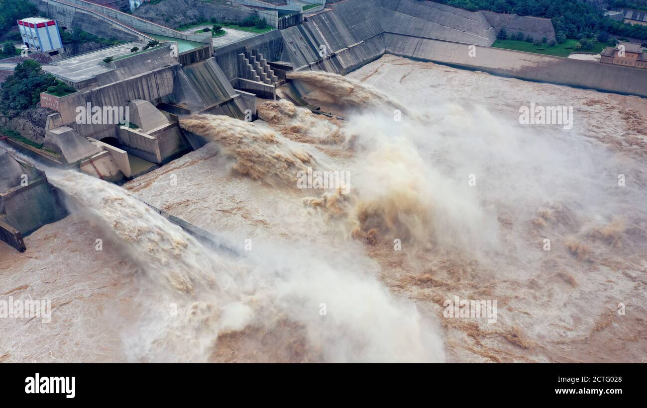 Aerial view of Xiaolangdi Dam disharging water to relieve flood in Jiyuan county, central China's Henan province, 22 August 2020. Stock Photo
