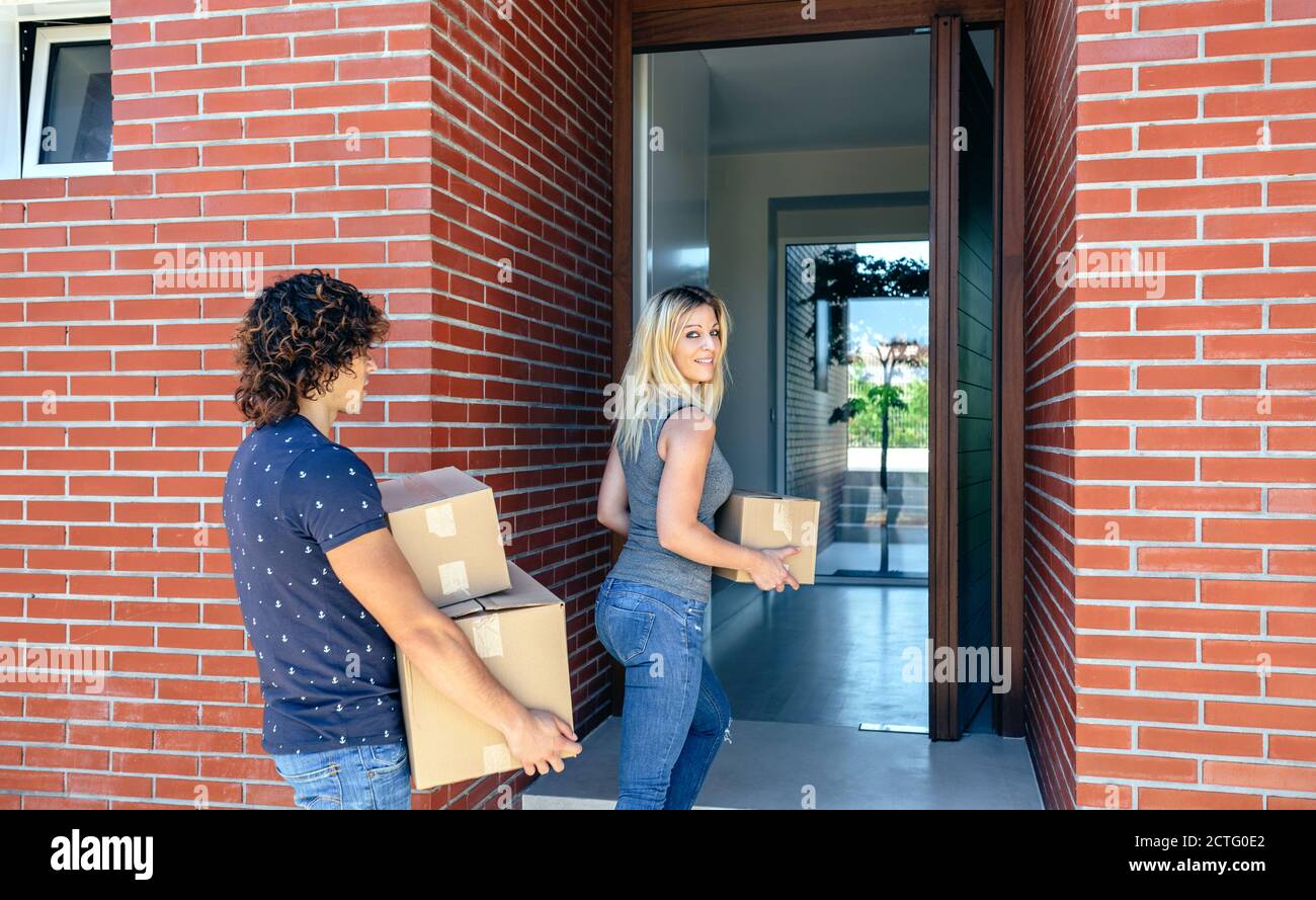 Couple moving into their new home Stock Photo - Alamy