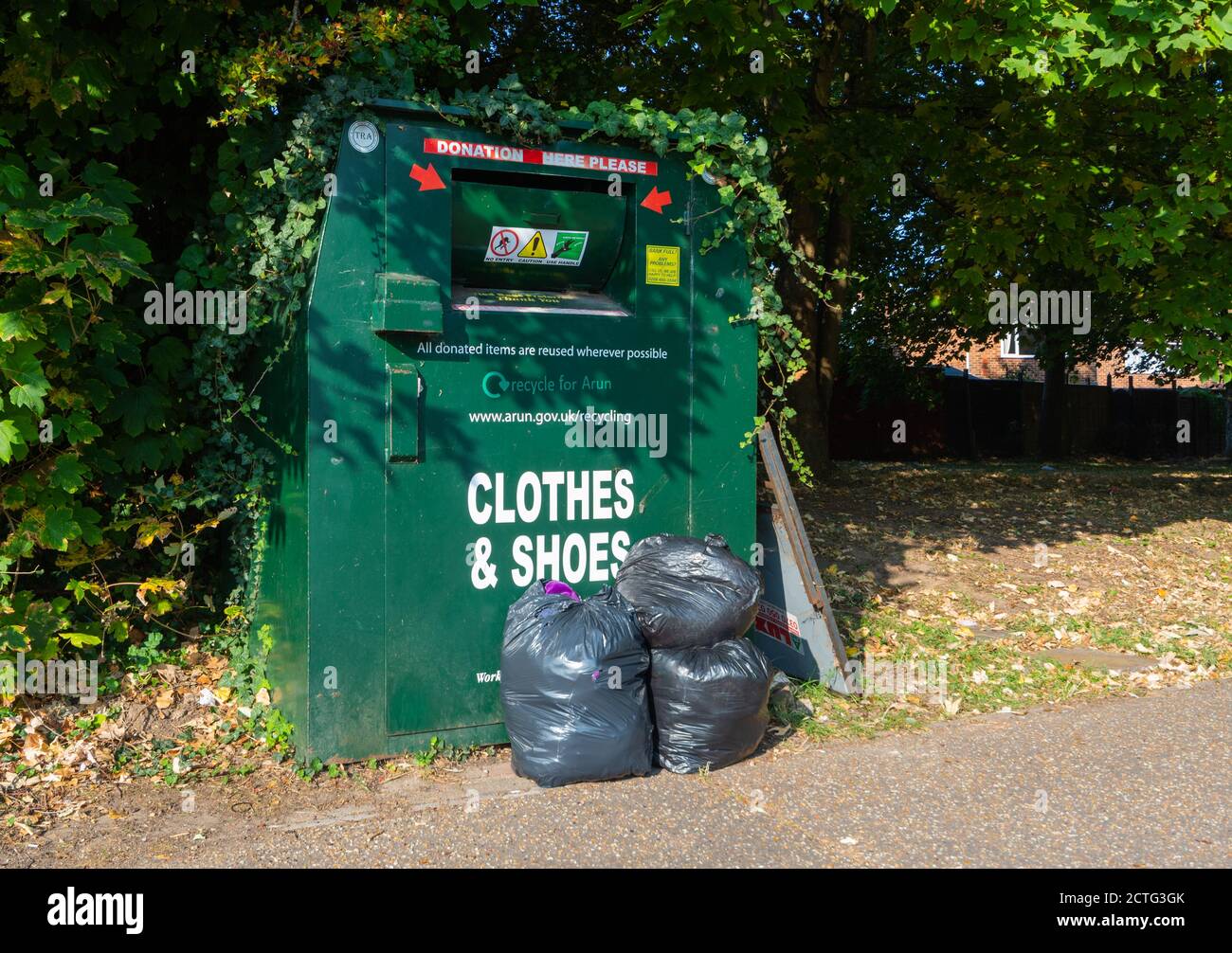 https://c8.alamy.com/comp/2CTG3GK/clothes-and-shoes-charity-donation-recycling-bin-in-west-sussex-england-uk-2CTG3GK.jpg