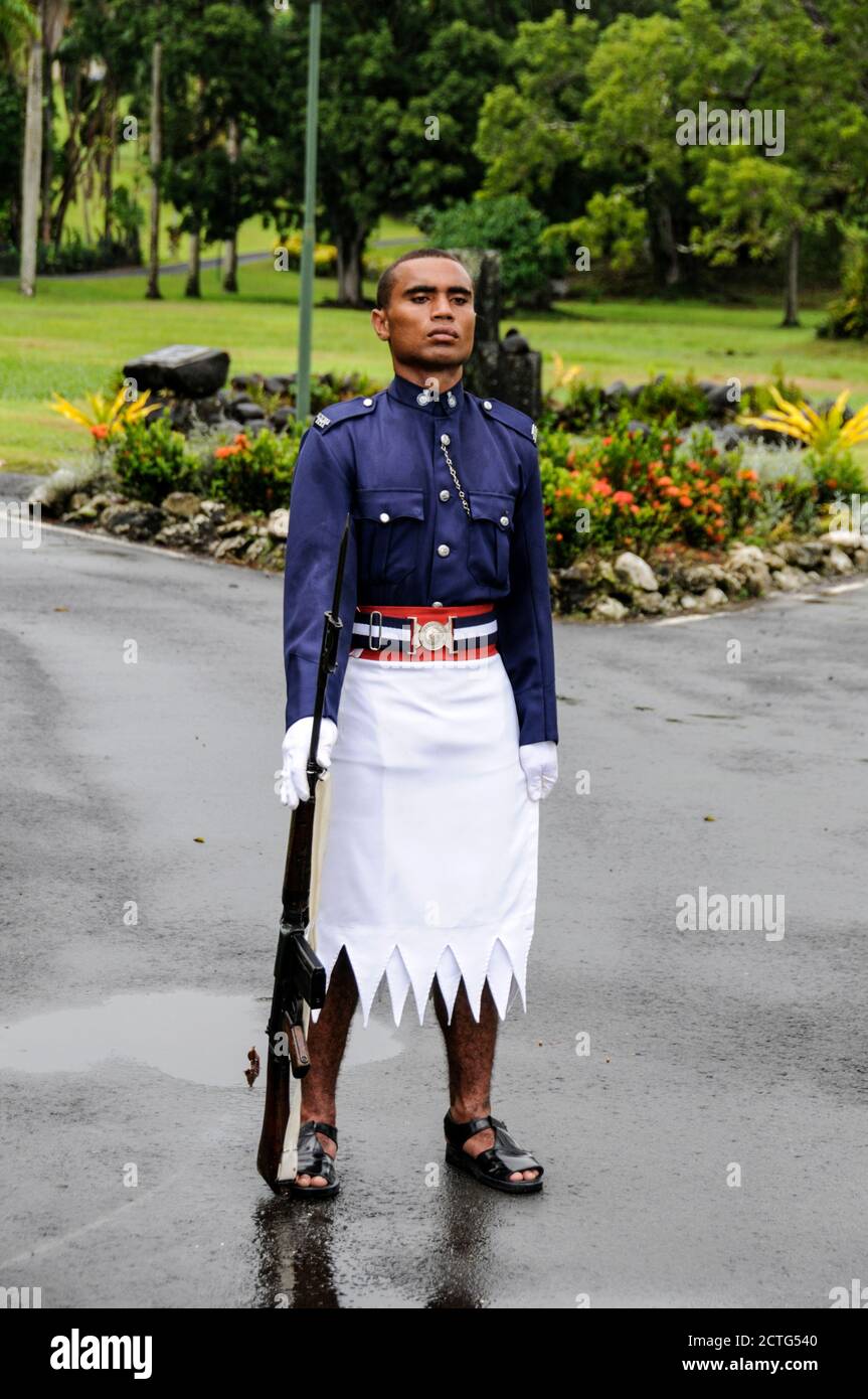 A sentry stands guard at the main driveway to Government House, residence of the President  in Suva on Viti Levu, Fiji Stock Photo