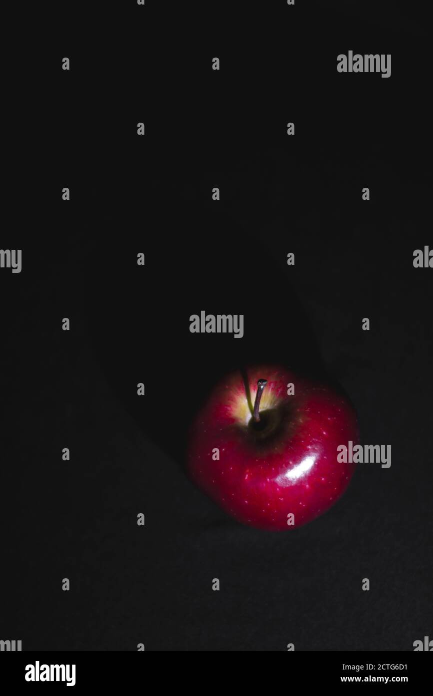 Apple fruit, abstract shadow, black background, red apple Stock Photo