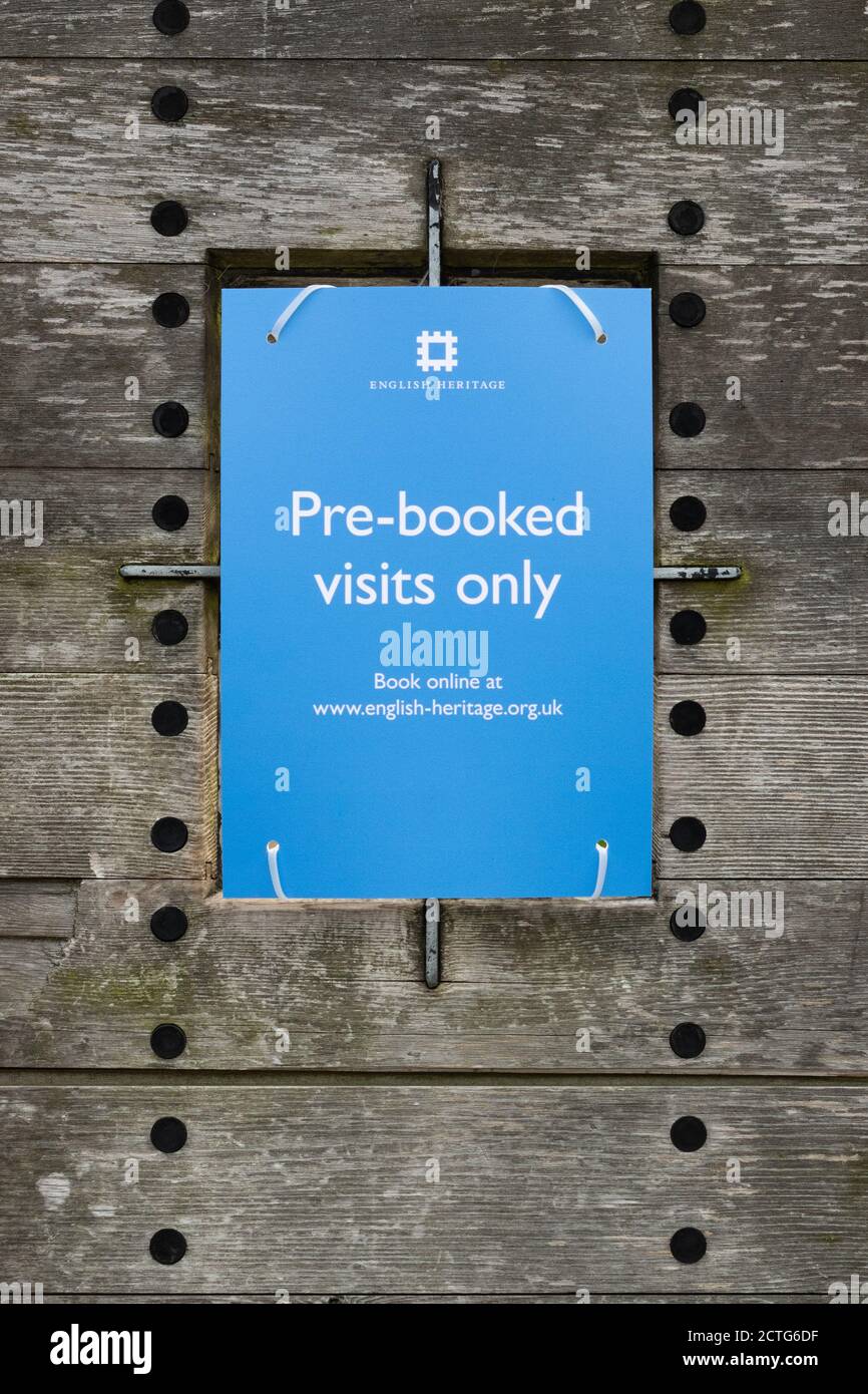 English Heritage Pre-booked visits only sign at entrance to Richmond Castle, Richmond, North Yorkshire, England, UK during the coronavirus pandemic Stock Photo