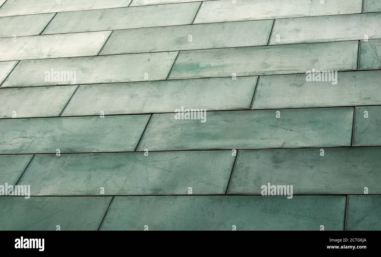 green tarnished copper background metal plates with copy space and