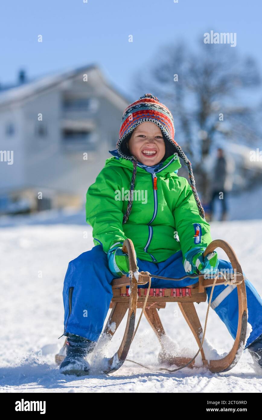 Funny afternoon in wintertime on sleigh Stock Photo