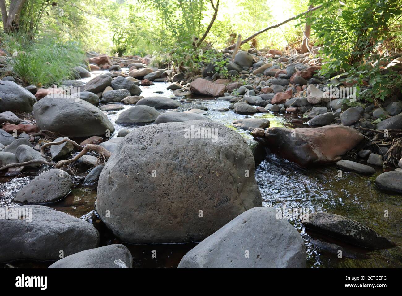Very Large River Rocks Closeup shot of big stones in the flowing river Stock Photo - Alamy