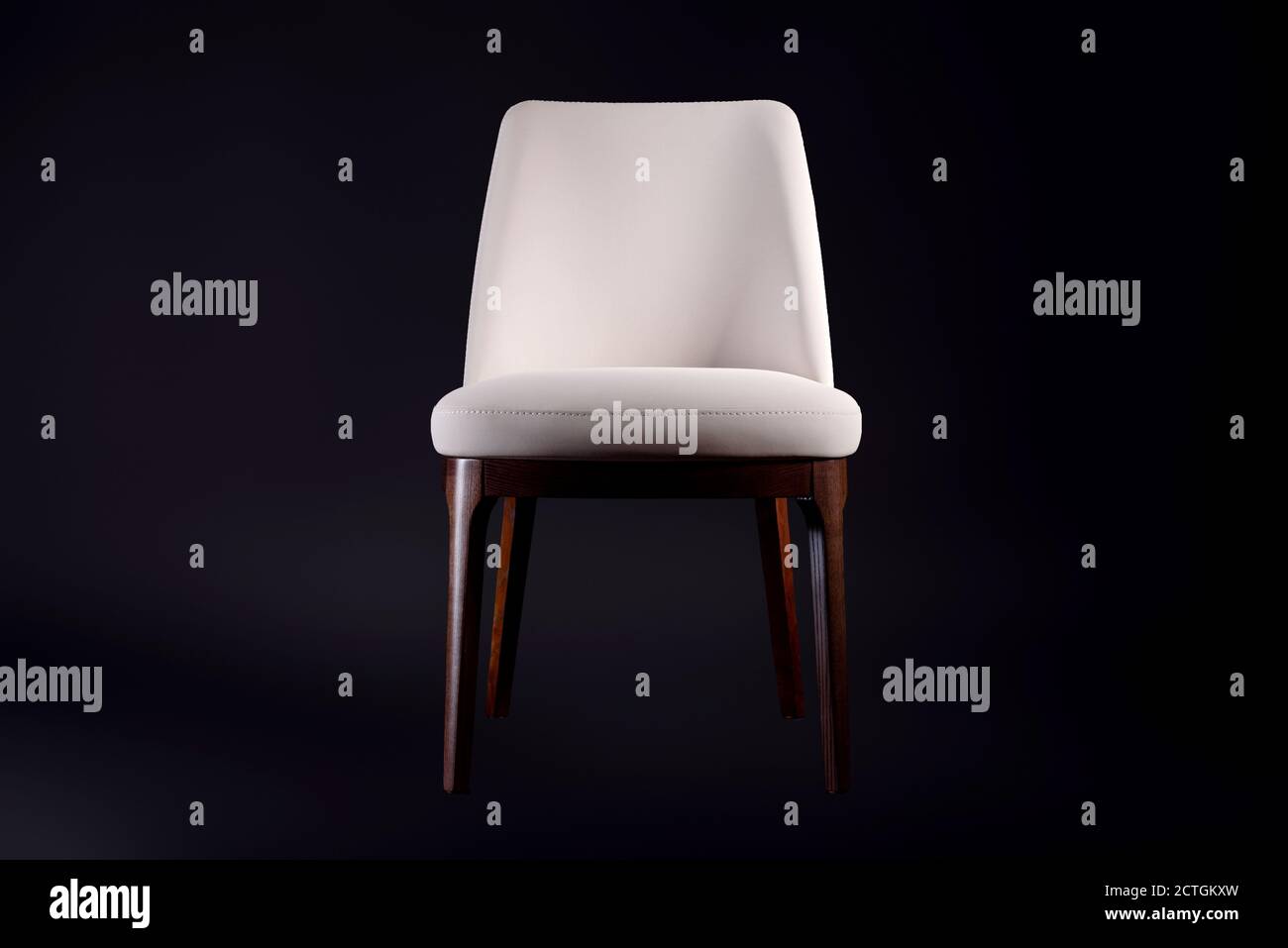 Beautiful comfortable chair with leather upholstery on a black