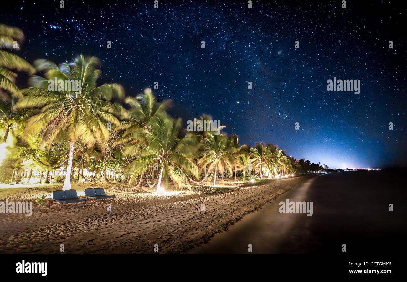 HOPKINS, BELIZE - Apr 18, 2019: A long exposure night scene of Hopkins Beach outside Hamanasi Adventure and Dive Resort in Belize's Stann Creek Distri Stock Photo