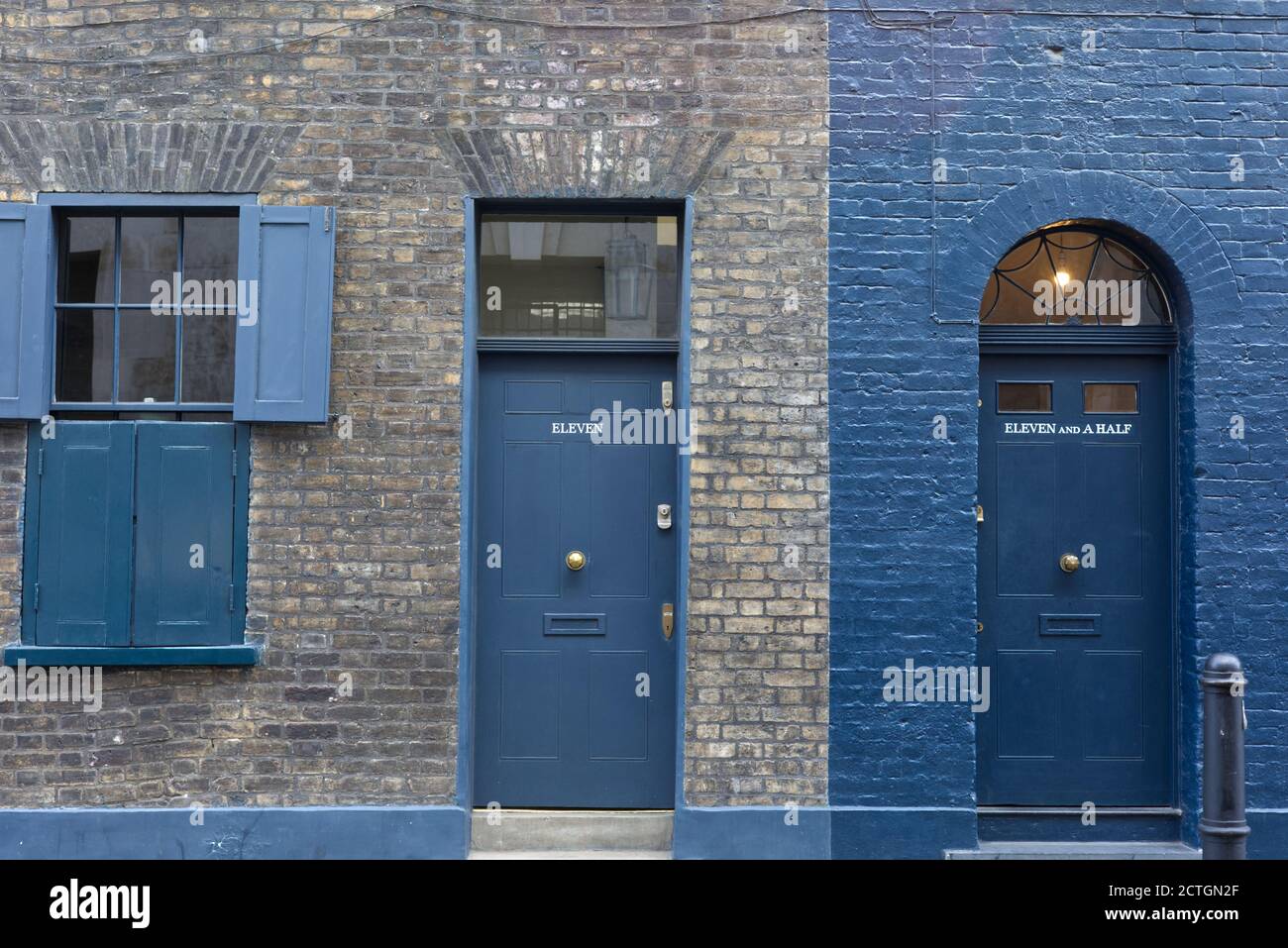 Eleven and eleven and a half, front doors, Victorian housing in the east end of  London Stock Photo