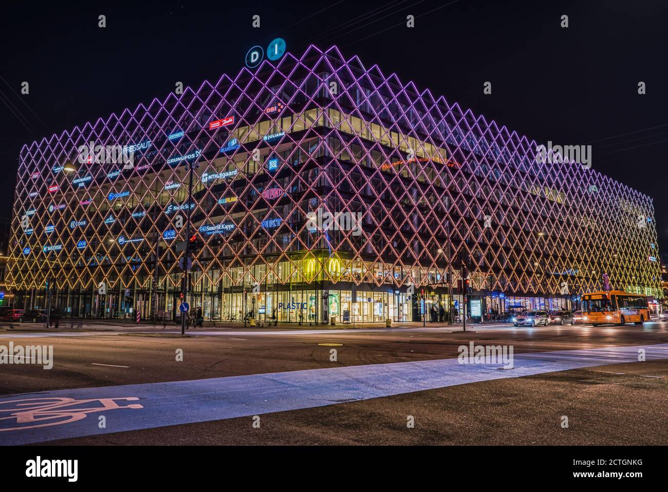 The House of Industry (Industriens Hus) in the City Hall Square (Radhuspladsen) at night with intense neon lighting on the facade bears urban style Stock Photo