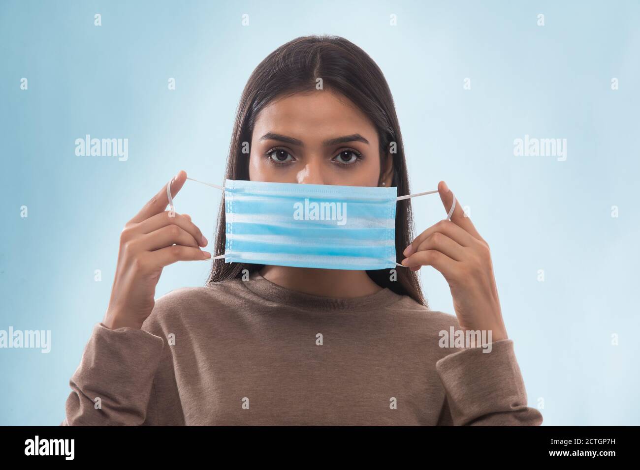 Woman wearing a mask hi-res stock photography and images - Alamy