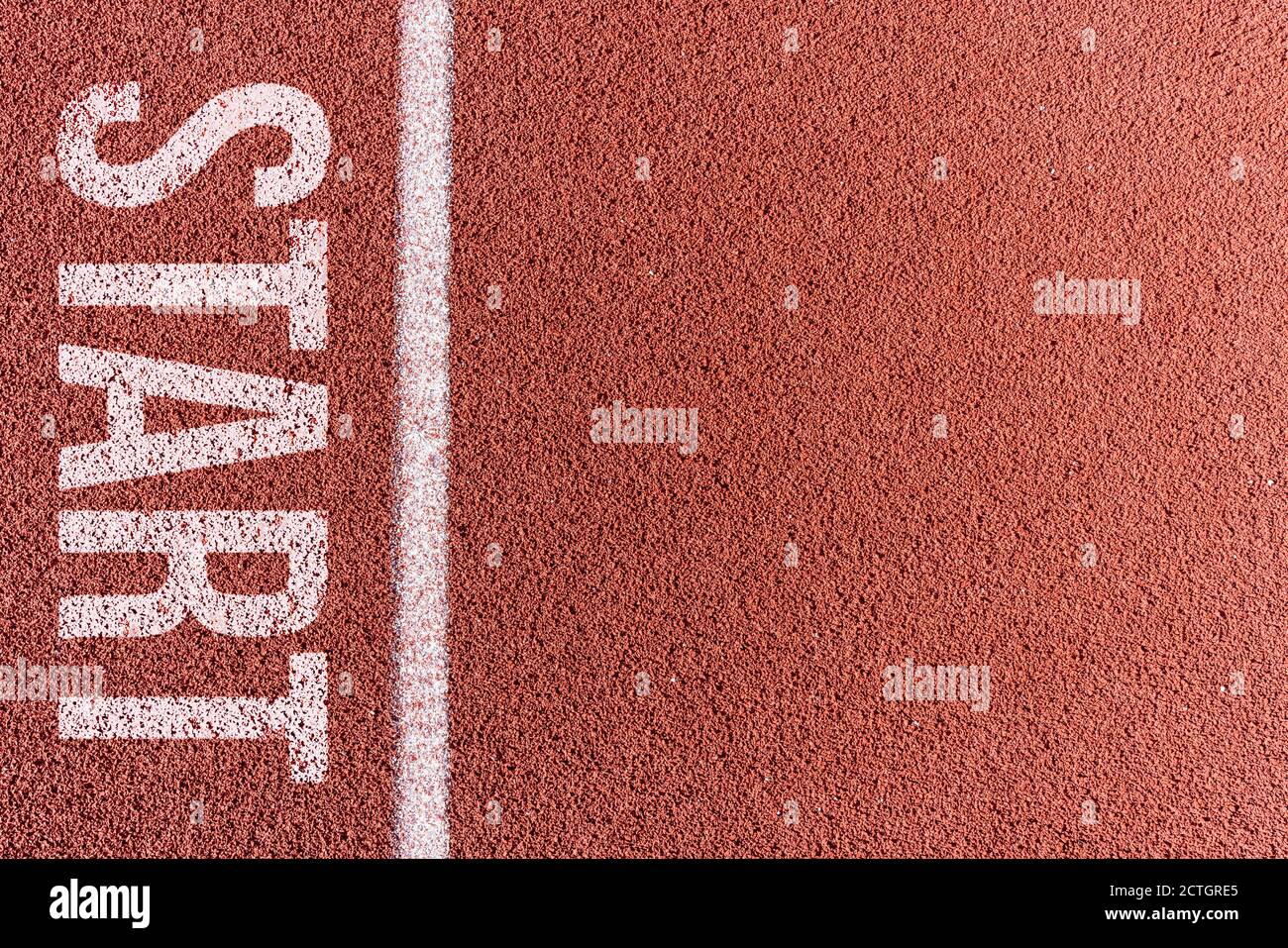 White painted line on tartan ground track in a athleticism and sports field. . High quality photo Stock Photo