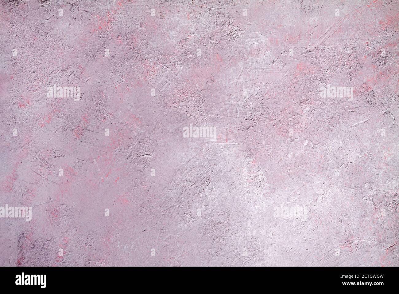 Concrete pink gray background with scuffs and black splashes. Textured wall texture in the grunge style. Stock Photo