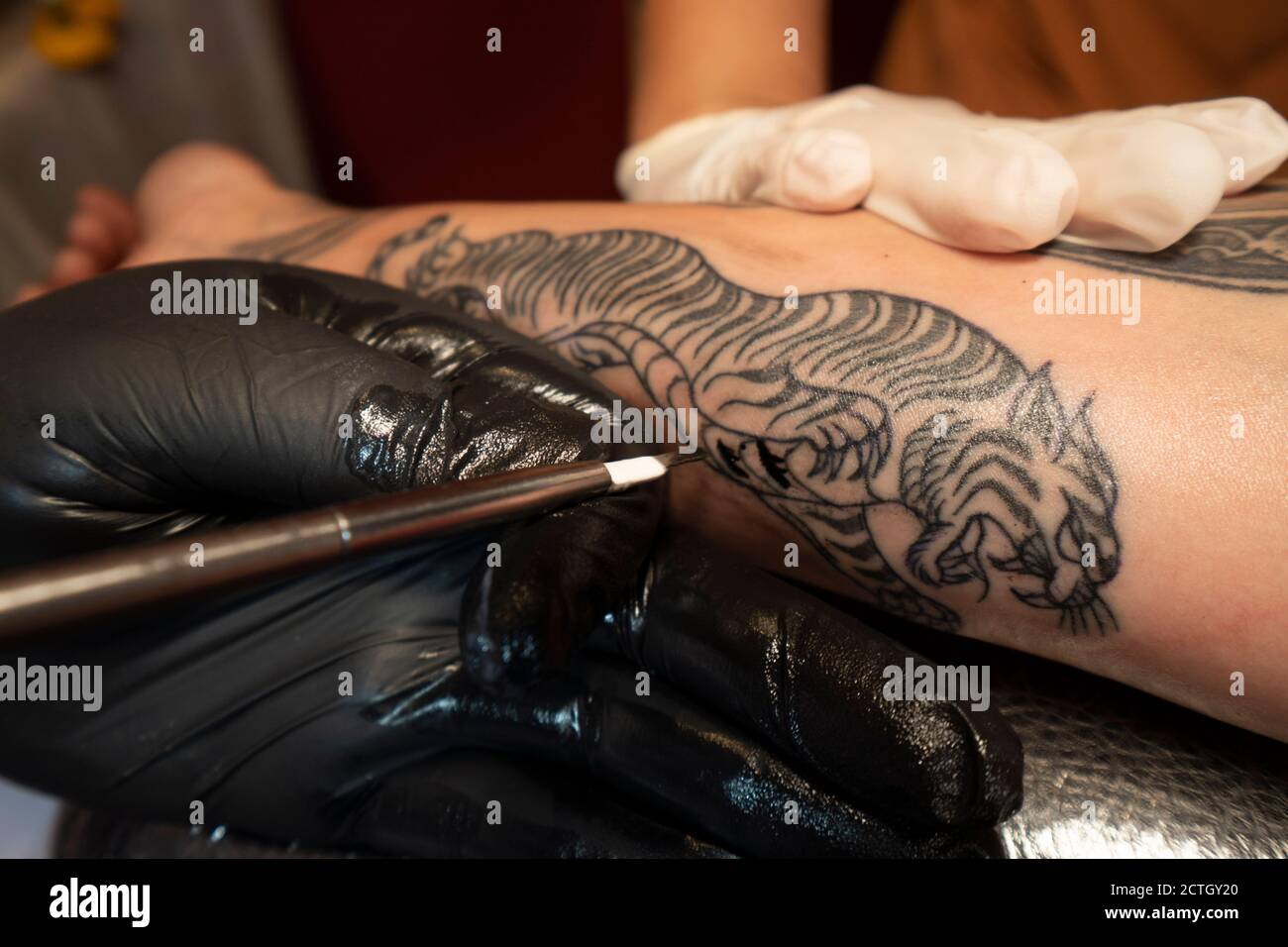 Tattoo Thia traditional method Stock Photo - Alamy
