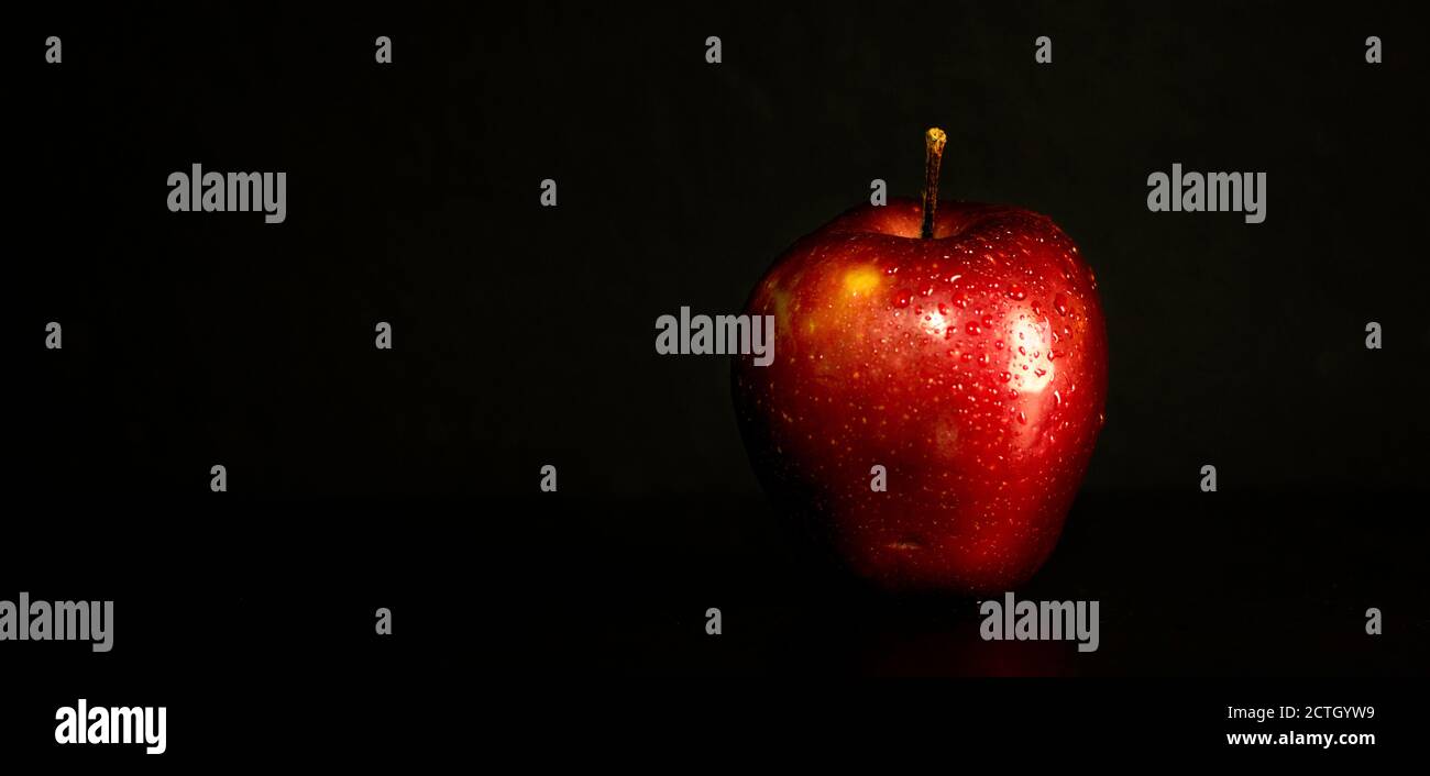 red apple with black backdrop Stock Photo