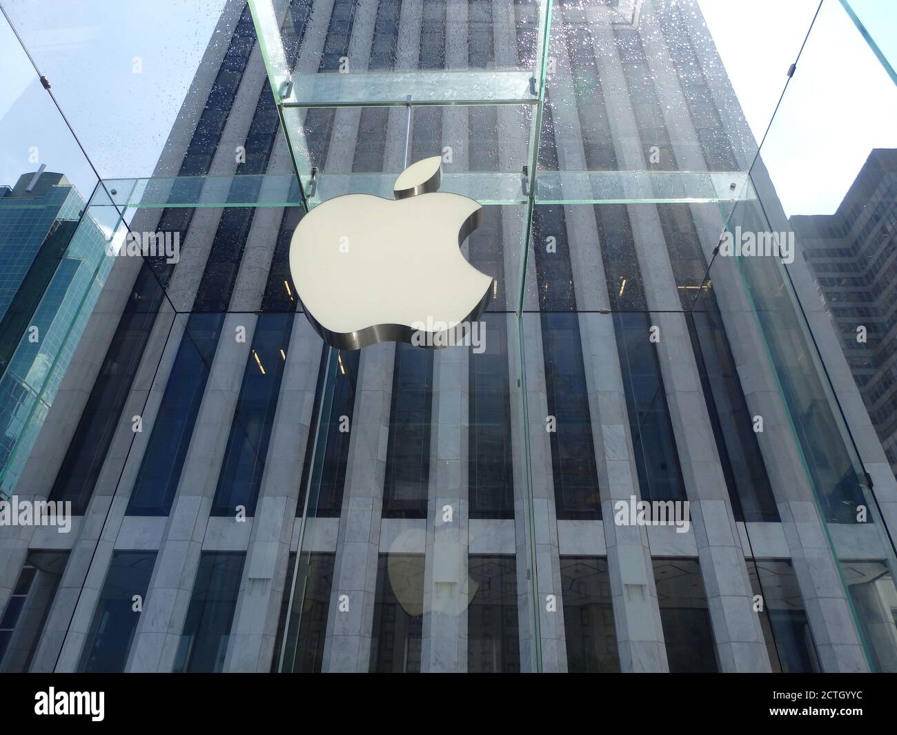 The Apple logo outside of the Apple store in New York City, USA Stock Photo