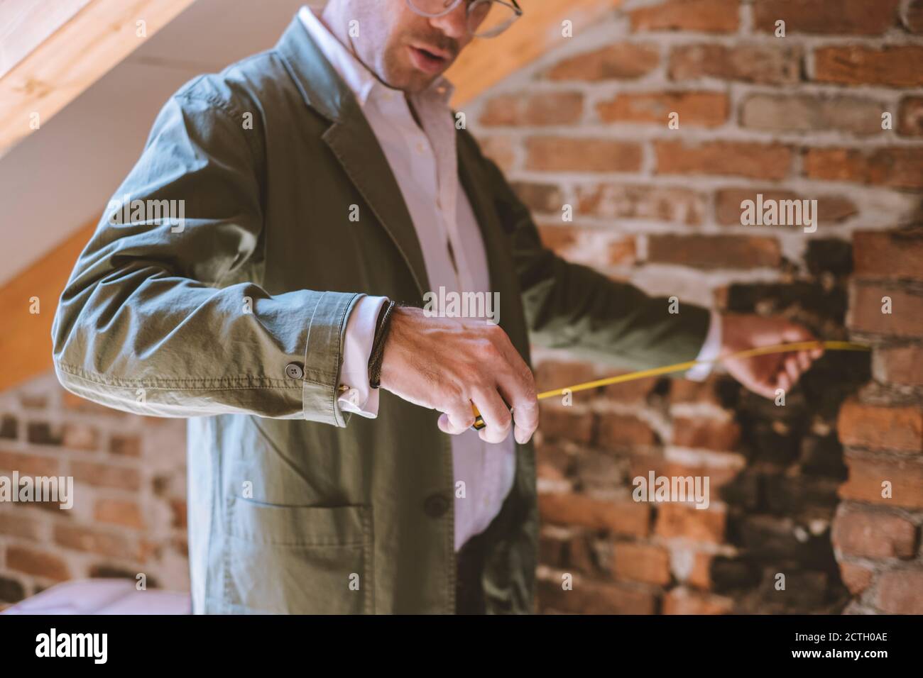 Architect at work with a measuring tape Stock Photo