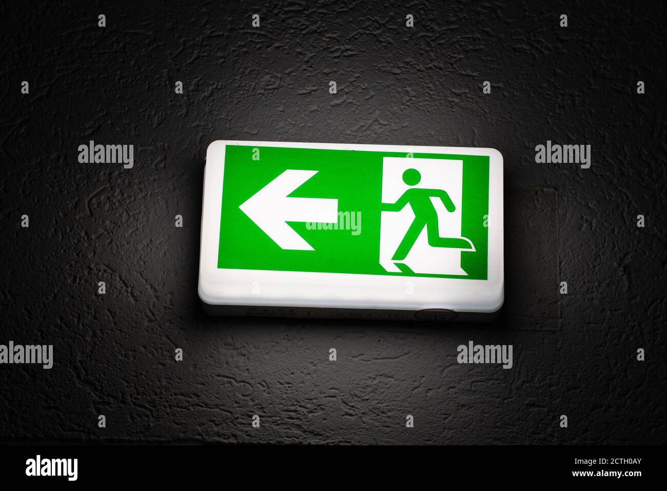 Emergency Exit sign in the dark Stock Photo