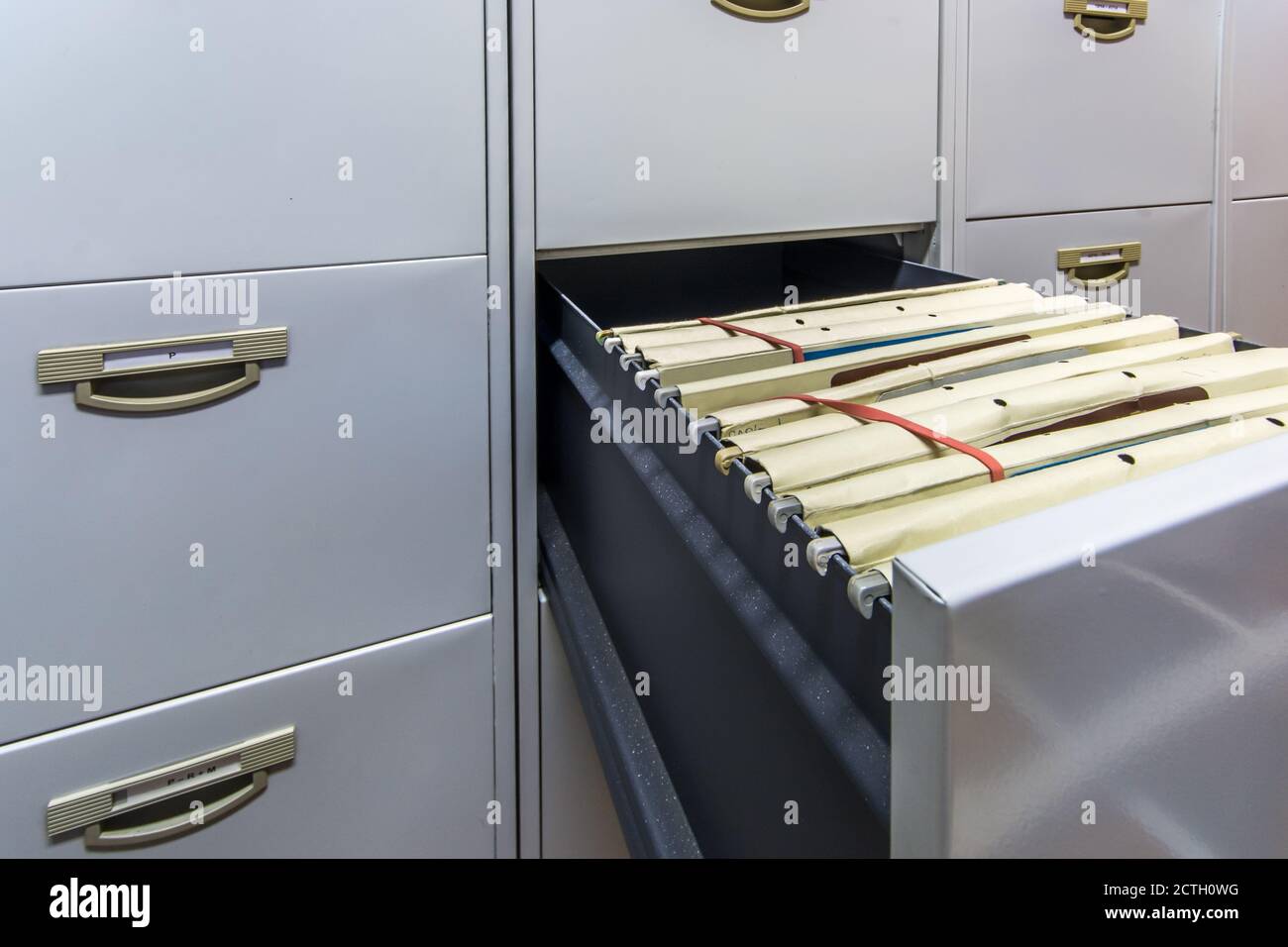 Drawer full of files in a large file cabinet Stock Photo