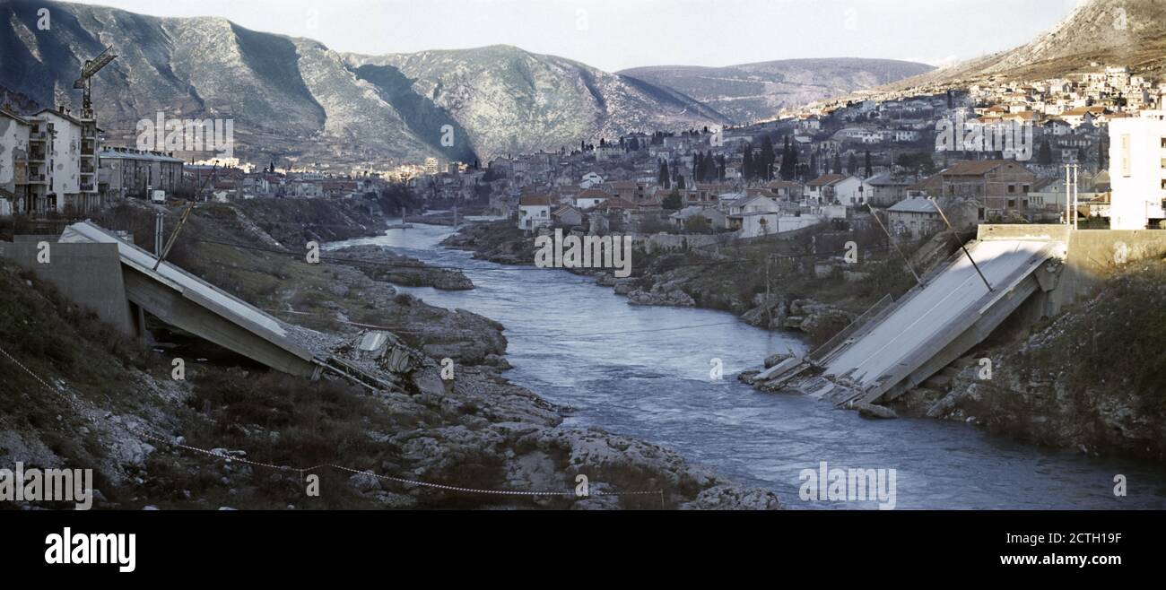 10th December 1995 During the war in Bosnia: the Neretva River flows past the destroyed Most Hasana Brkića (Hasan Brkića Bridge) on the southern outskirts of Mostar. Stock Photo