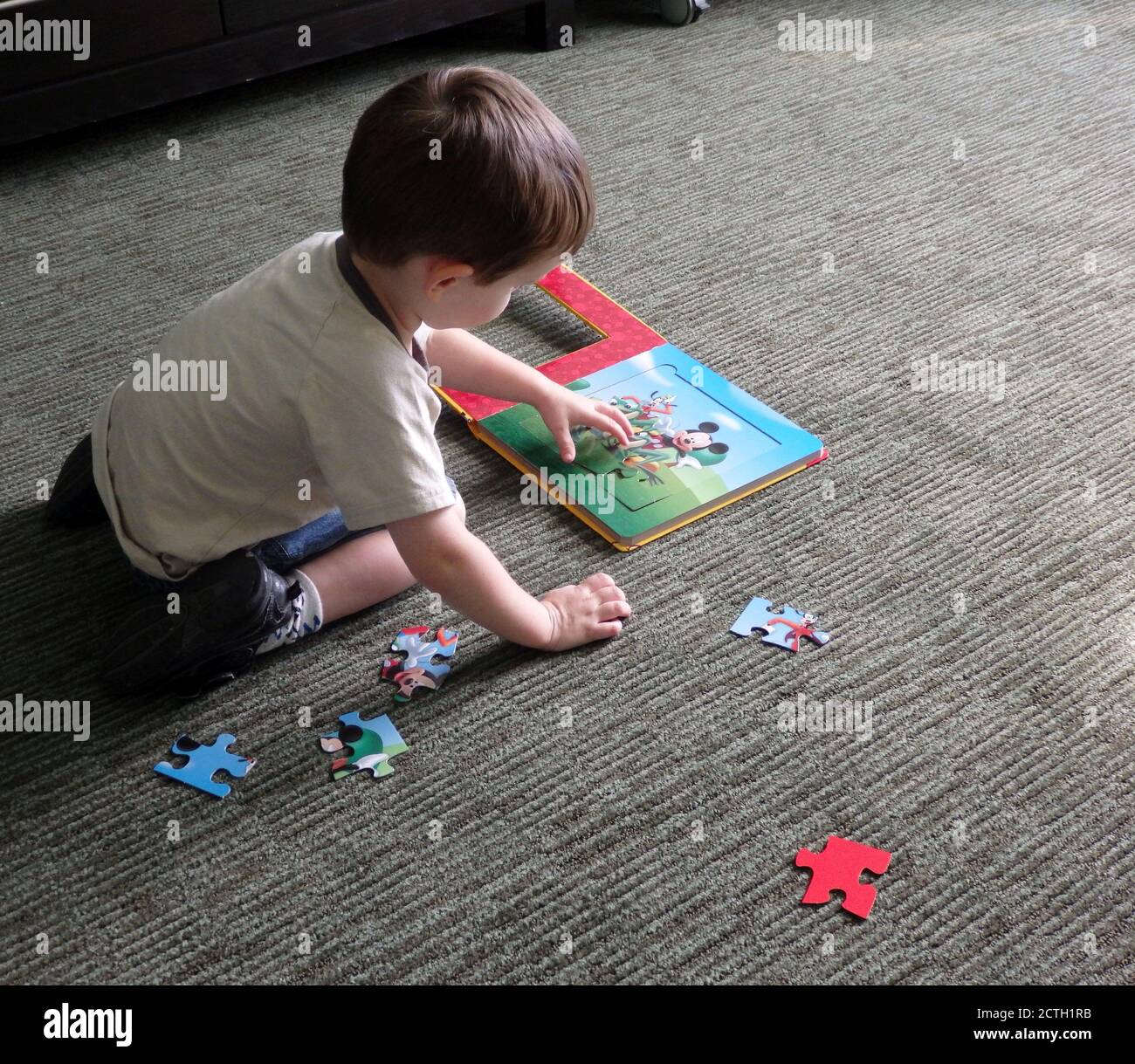 A young boy doing a jigsaw puzzle Stock Photo Alamy
