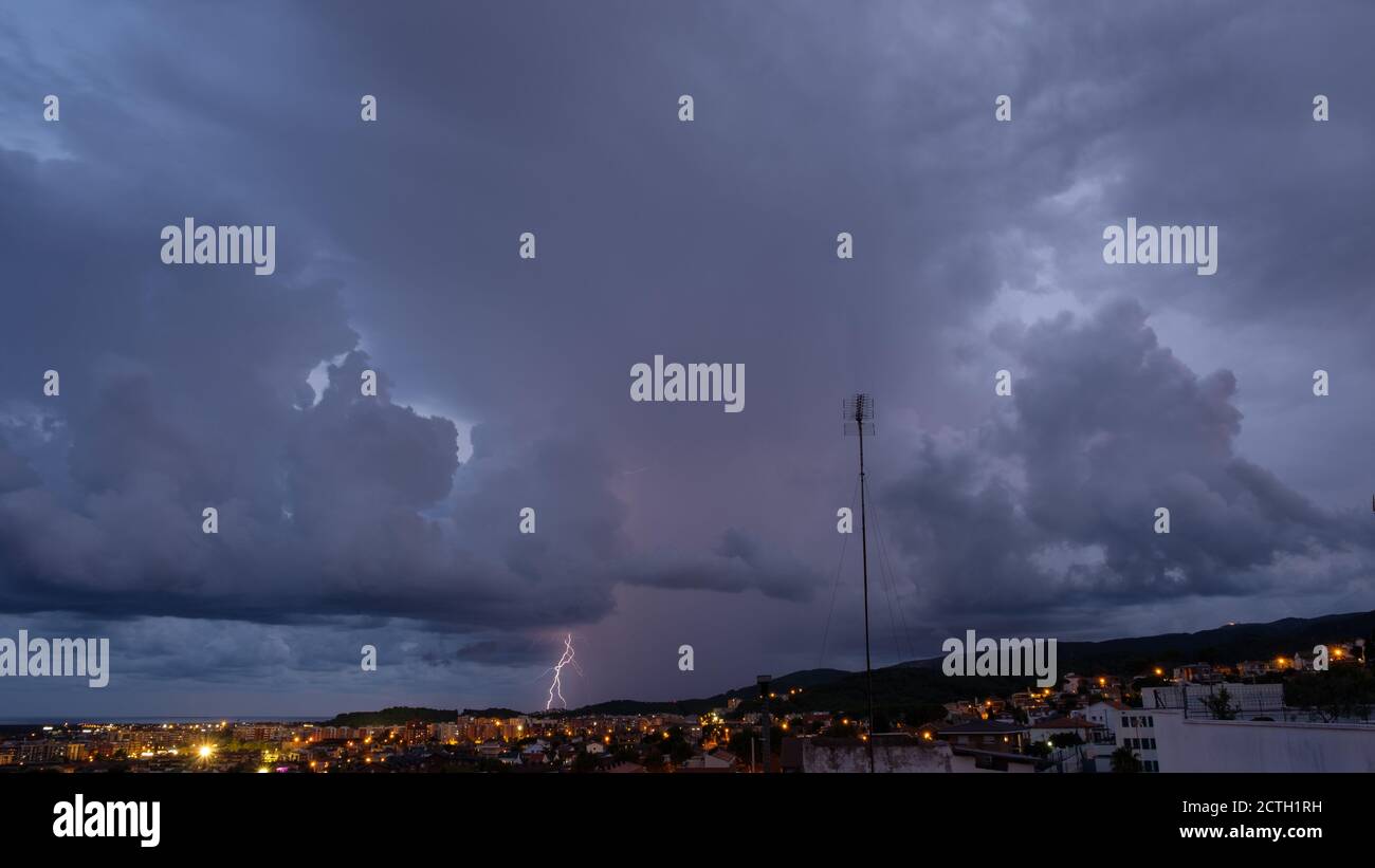 Lightning in the night sky over the city Stock Photo - Alamy