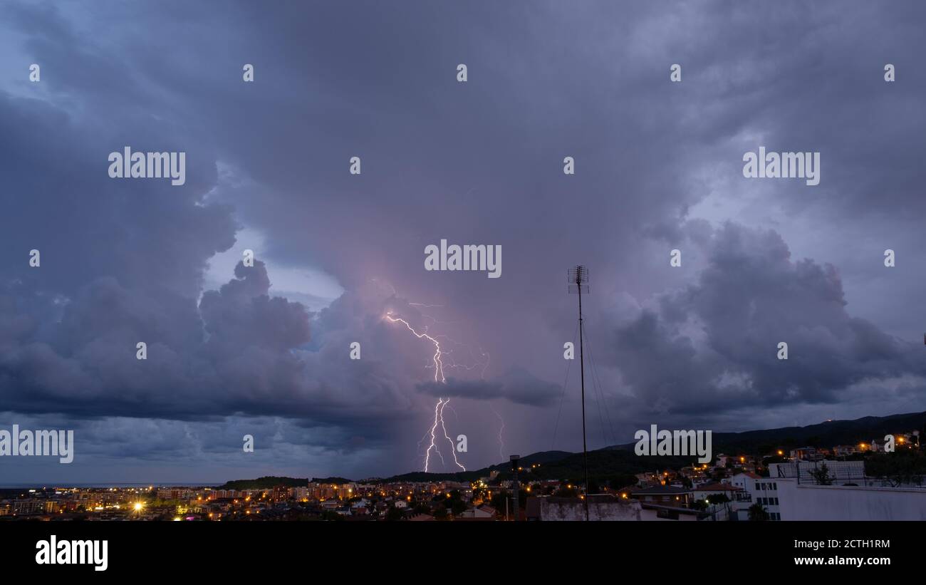 Lightning in the night sky over the city Stock Photo - Alamy