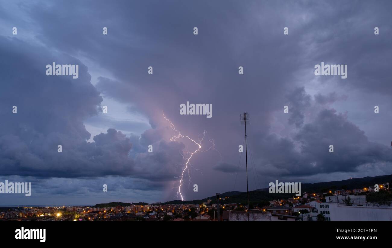 Lightning in the night sky over the city Stock Photo - Alamy
