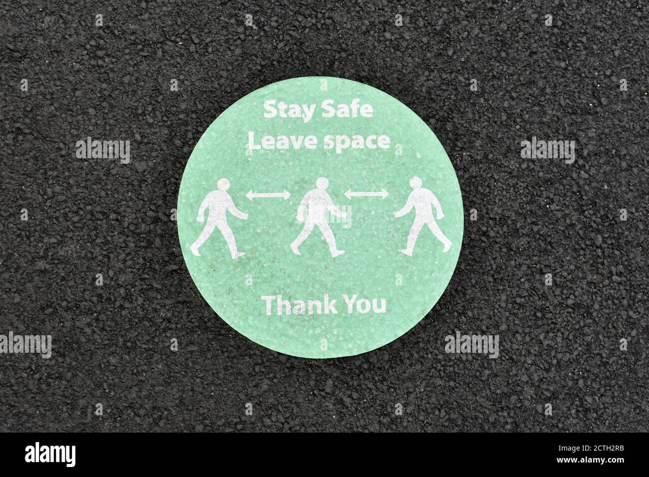 Leave Suitable Distance Sign close up of people social distancing sign on tarmac background to stay ...