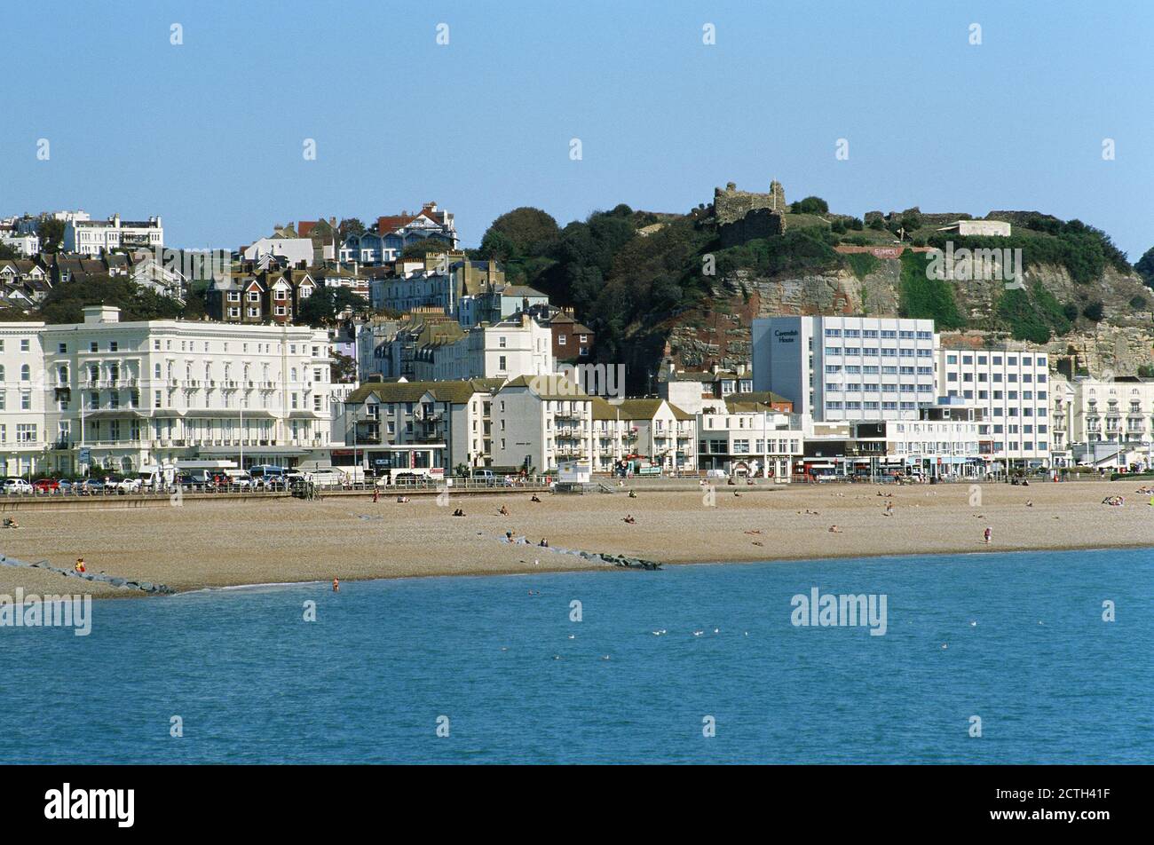 Hastings seafront, East Sussex, Southern England, looking towards the West Hill, from the pier Stock Photo