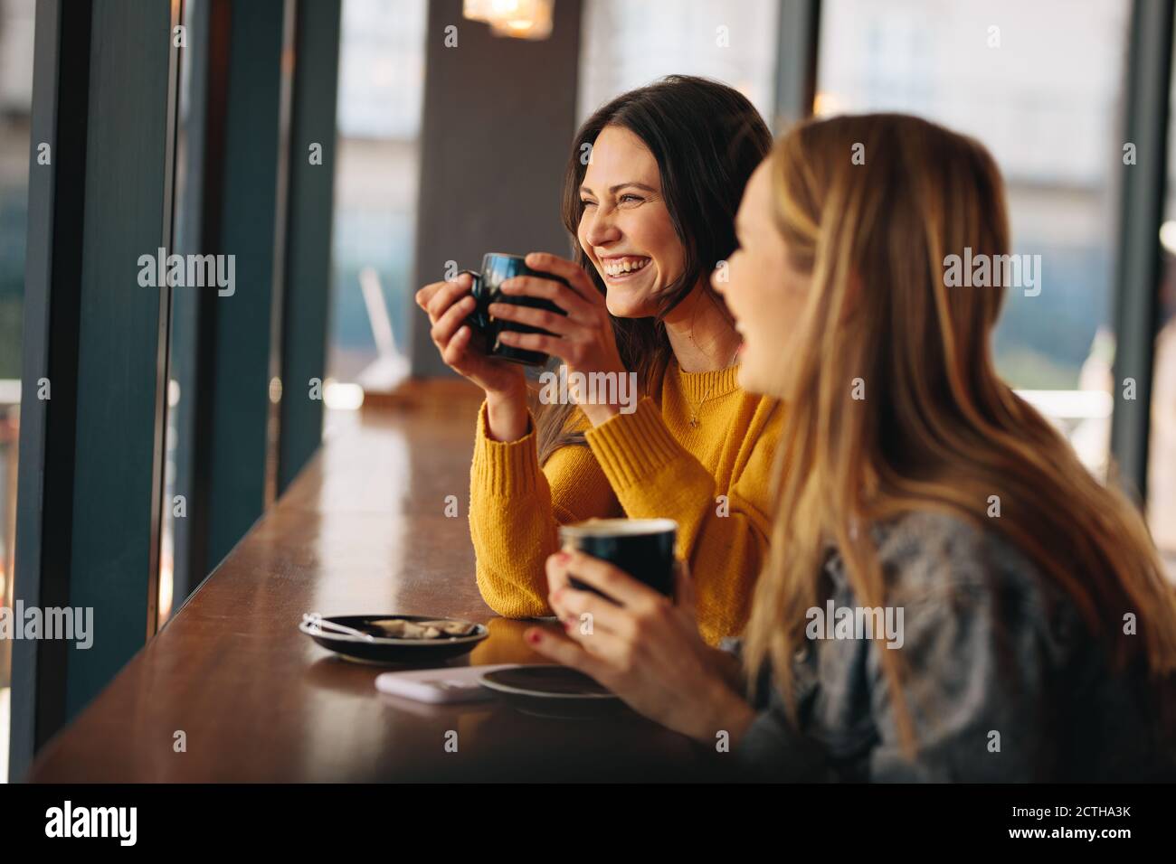Two women in cafe having a drink hi-res stock photography and images ...