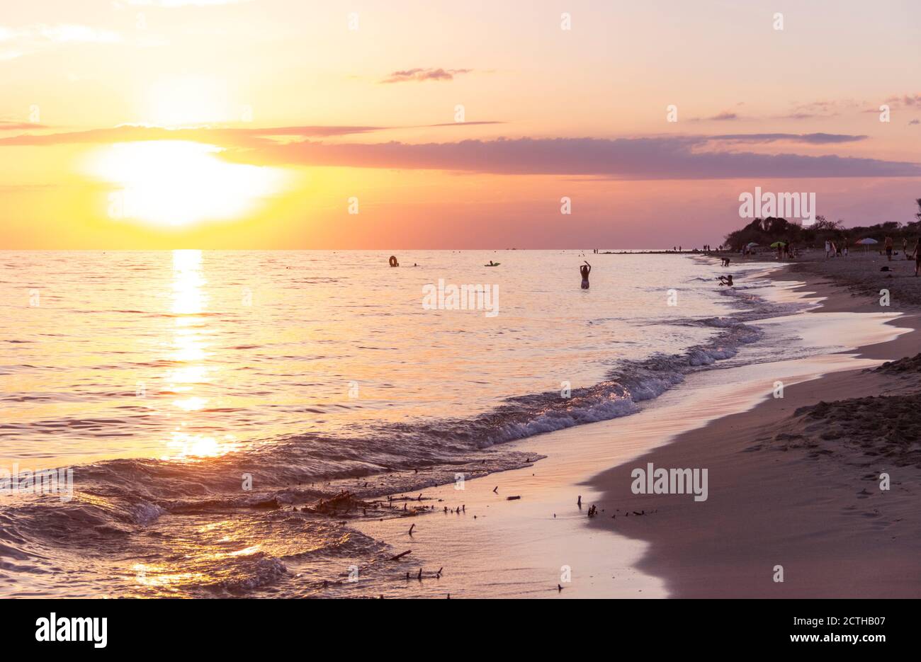 Summertime: beach sunset. Torre Mozza Beach  is one of the longest and most appealing among those in the South part of Salento in Apulia, Italy. Stock Photo
