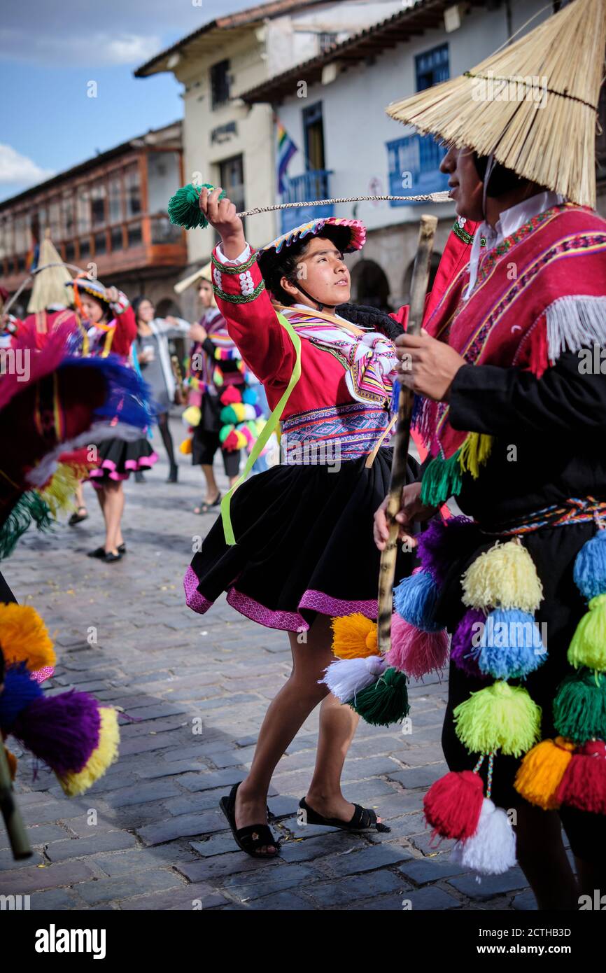 A young woman in colourful colorful dress dancing during the Inti Raymi'rata sun festival over the winter solstice, Cusco, Peru Stock Photo