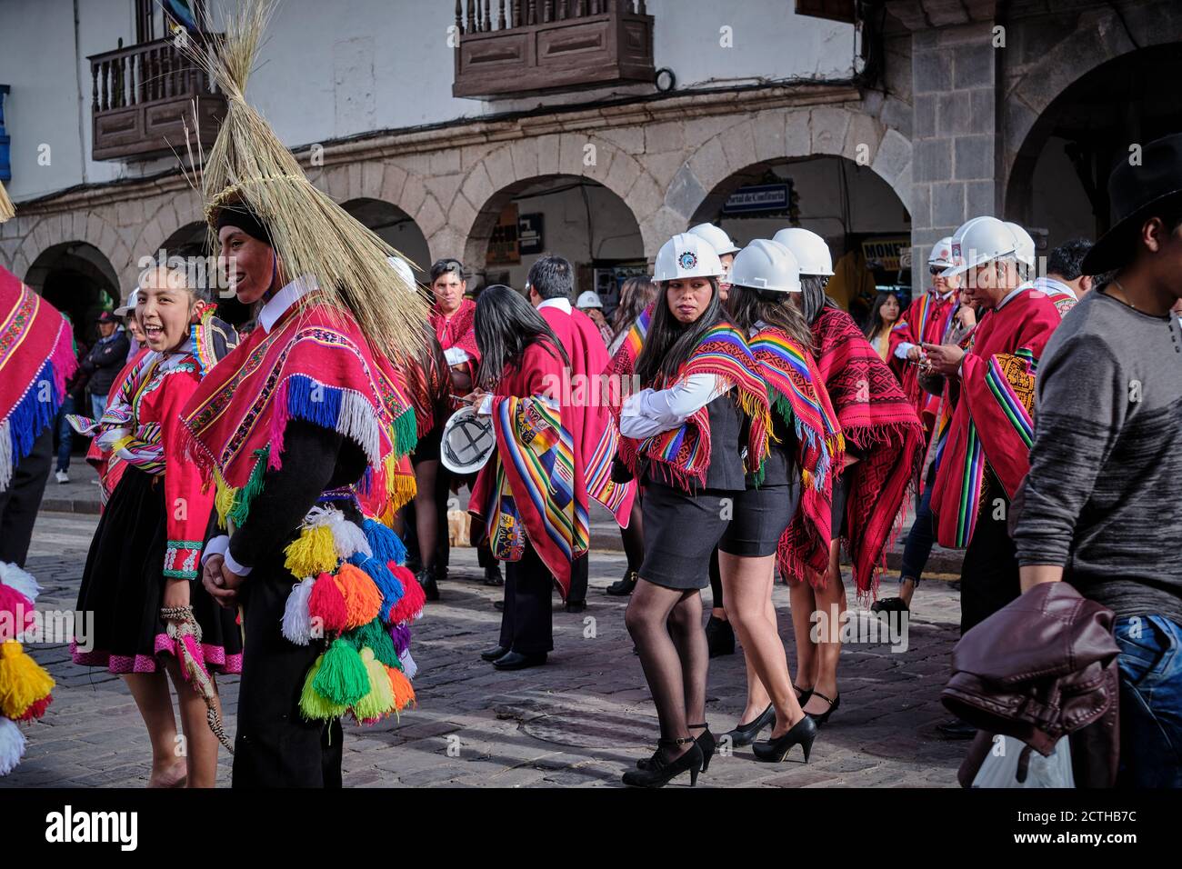 Female engineers in hard hats women waiting their turn in the procession for the Inti Raymi'rata sun festival over the winter solstice, Cusco, Peru Stock Photo