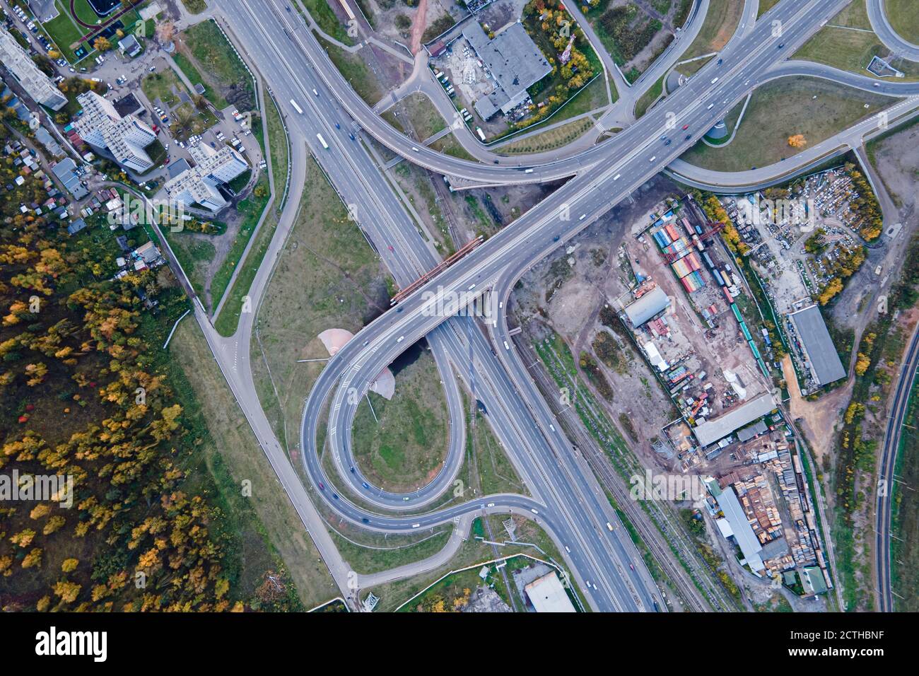 road interchange on the outskirts of the city of Krasnoyarsk, captured on a drone camera, top view, forest outskirts and infrastructure Stock Photo