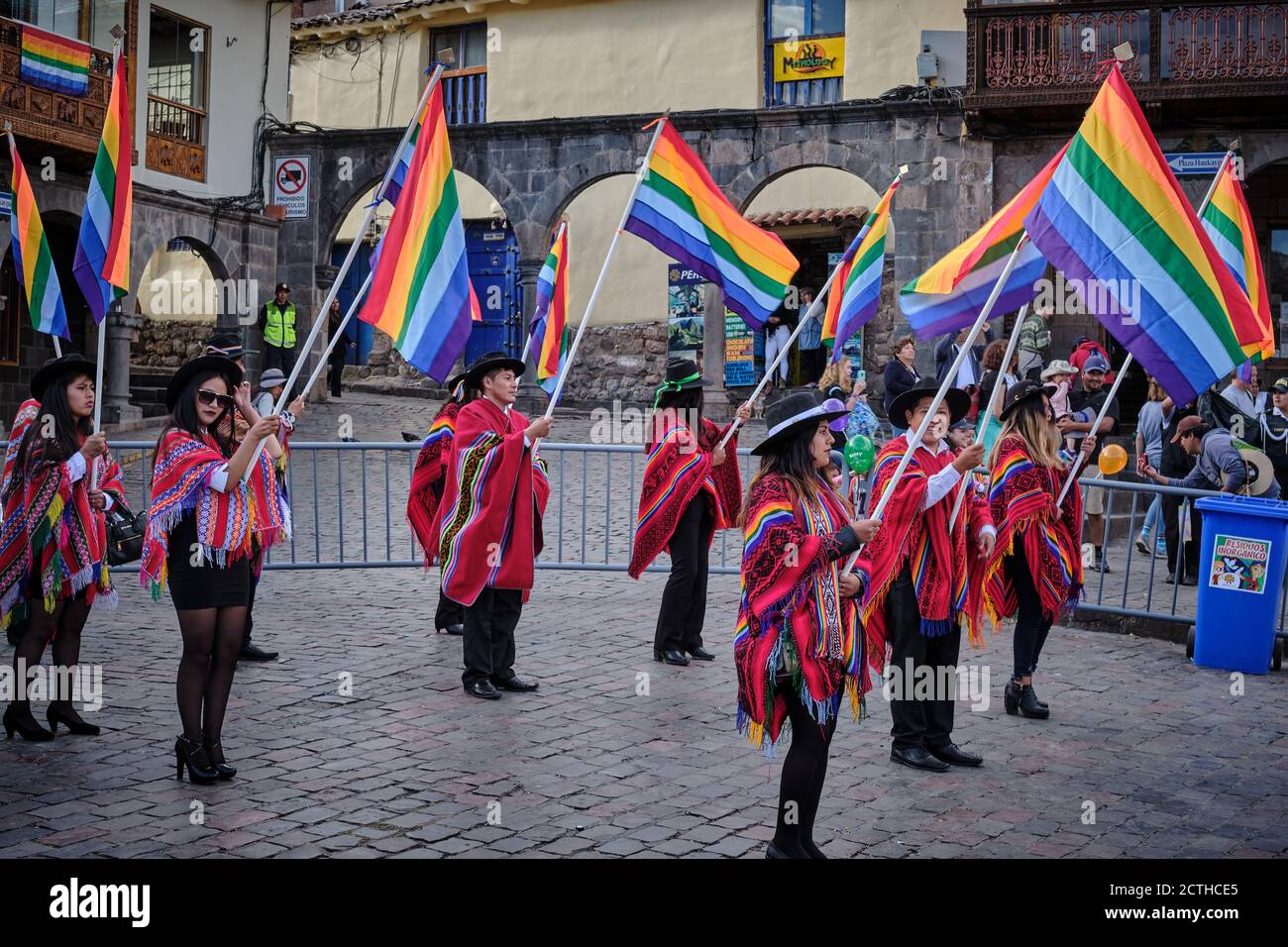 Office workers carrying rainbow flags of Cusco in a procession during the Inti Raymi'rata sun festival over the winter solstice, Cusco, Peru Stock Photo
