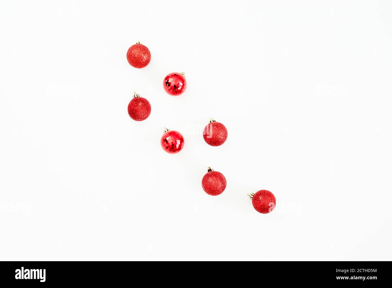 Christmas concept with red balls decoration on white background. Flat lay, top view Stock Photo