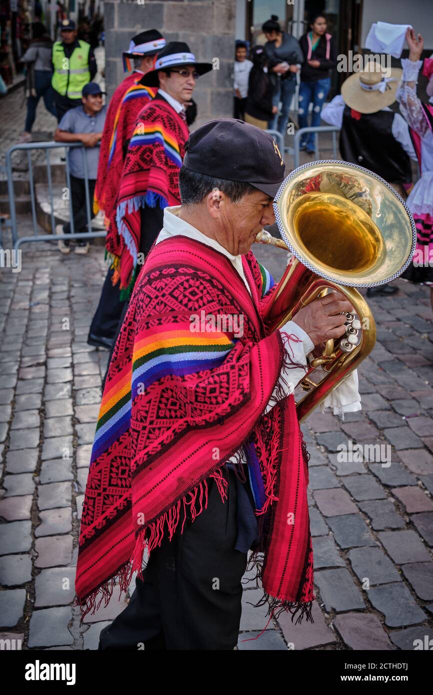 A tuba player in a marching band in colourful colorful costume during the Inti Raymi'rata sun festival over the winter solstice, Cusco, Peru Stock Photo
